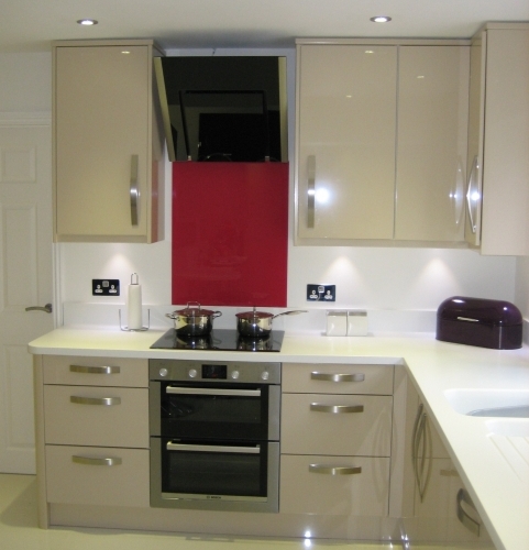 Gloss Sand Beige Kitchen with Corian worktops and Neff appliances for Mr and Mrs Ironside