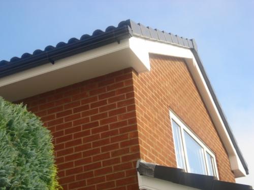 Barge Boards withGrey Dry Verge caps and black Ogee deep flow guttering