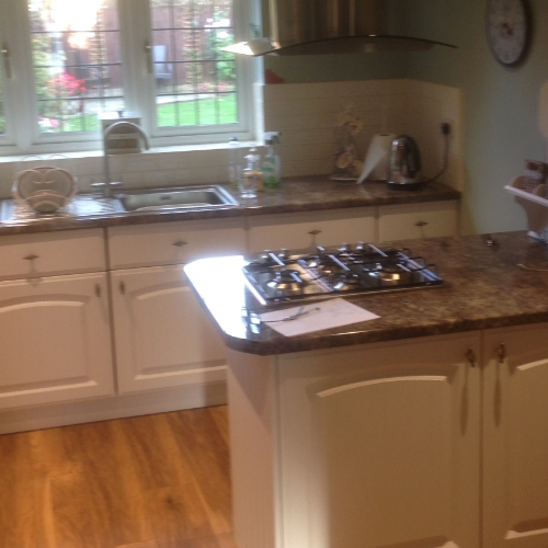 After. A Brighter transformation achieved by changing the doors and worktops